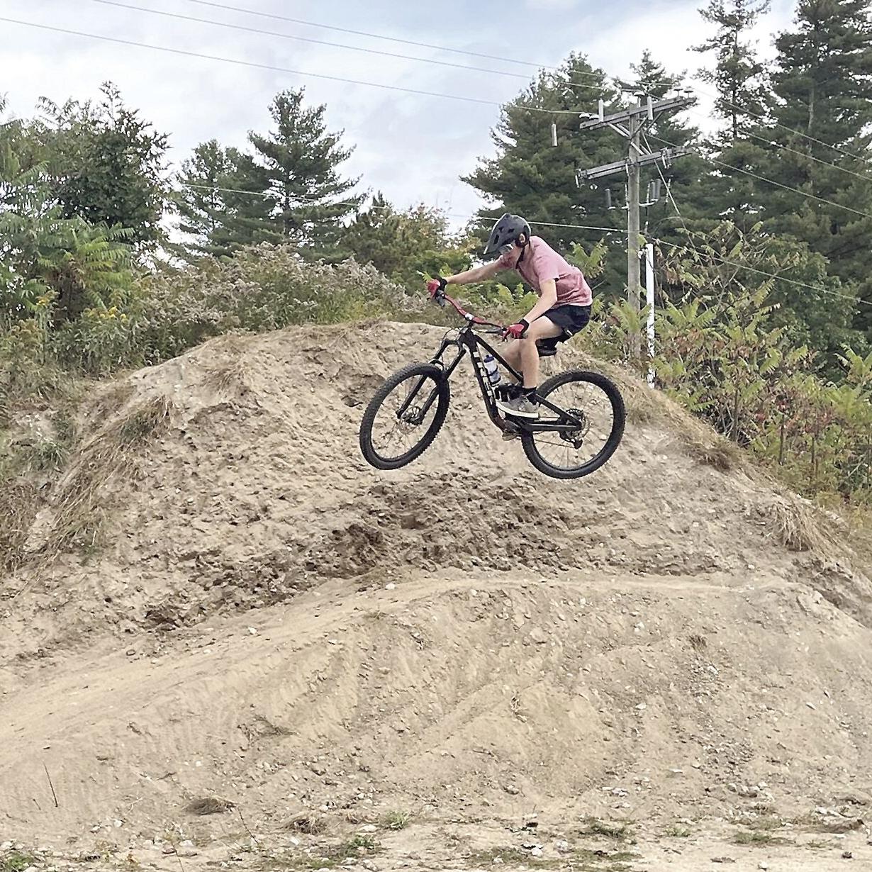 Wheel Fun - Mountain biker in the air